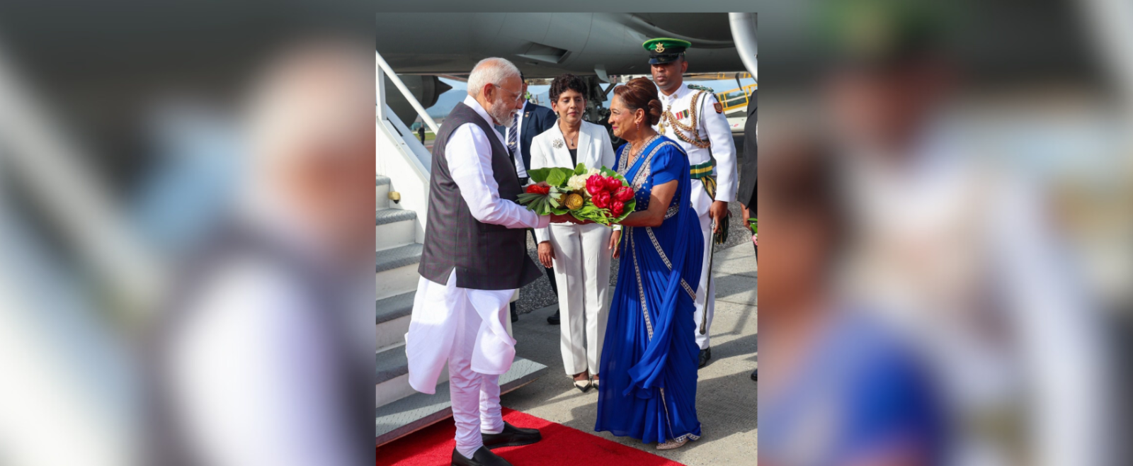 The Honourable Prime Minister of the Republic of Trinidad and Tobago, Kamla Persad-Bissessar, warmly welcomed Shri Narendra Modi upon his arrival at the Piarco International Airport.