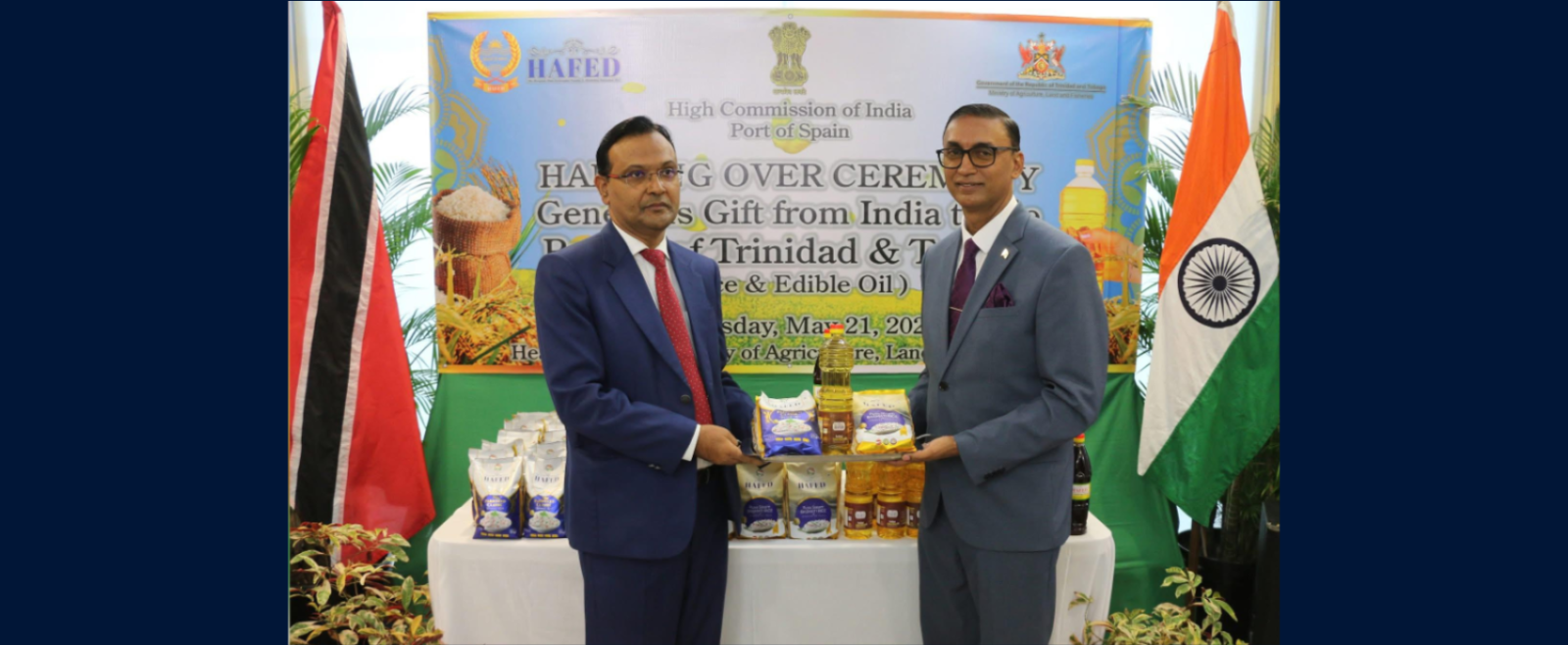 His Excellency Dr. Pradeep Rajpurohit formally handing over the donation of rice and edible oil from the Indian government to Senator the Honourable Ravi Ratiram Minister of Agriculture,Land and Fisheries of Trinidad and Tobago