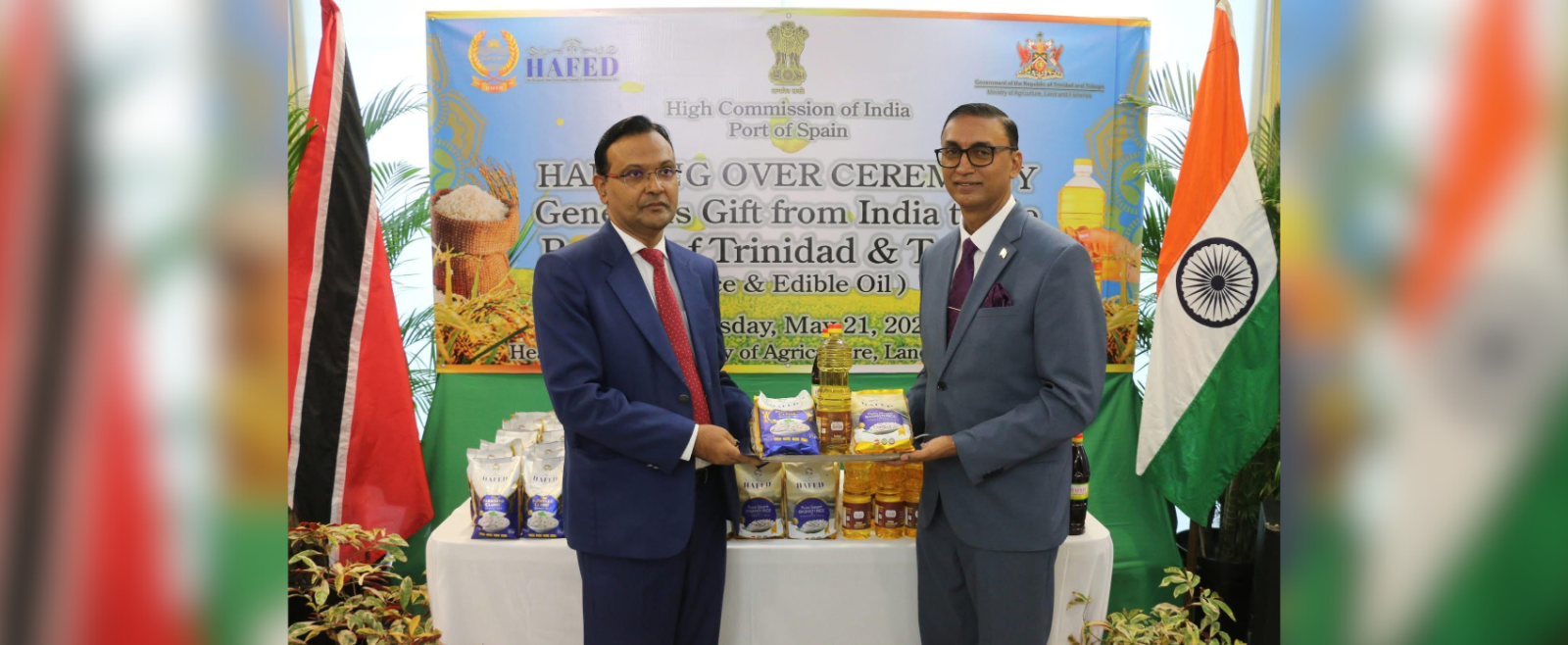 His Excellency Dr. Pradeep Rajpurohit formally handing over the donation of rice and edible oil from the Indian government to Senator the Honourable Ravi Ratiram Minister of Agriculture,Land and Fisheries of Trinidad and Tobago