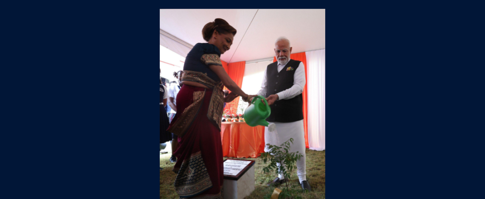 Prime Minister of India Shri Narendra Modi, and the Honourable Kamla Persad-Bissessar, Prime Minister of the Republic of Trinidad and Tobago, planting a tree in honour of the 'Ek Ped Maa Ke Naam' initiative